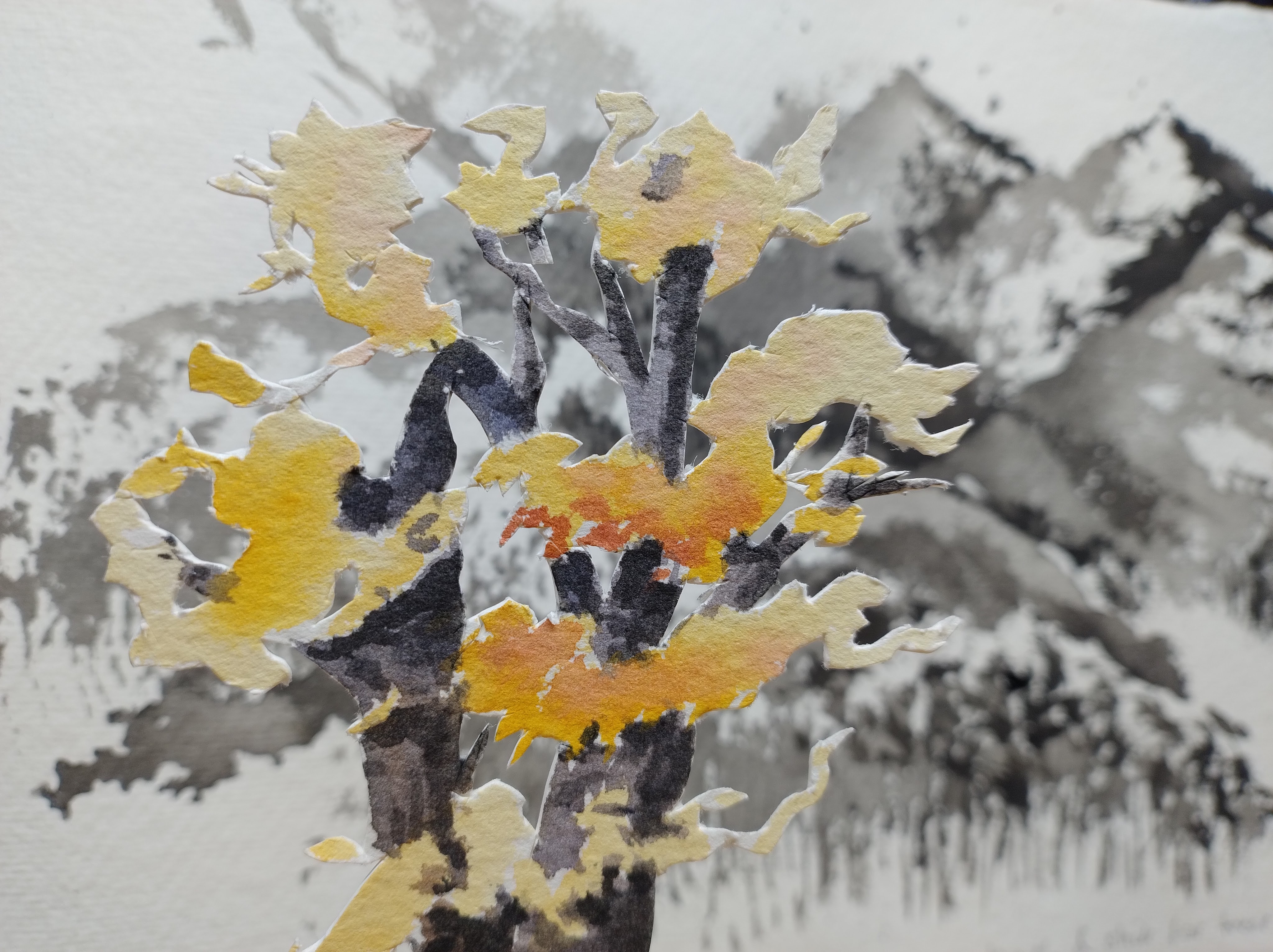 A tree cut from a watercolour painting in front of a painted background.